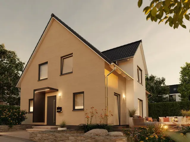 Das Massivhaus Lichthaus 152 in stimmungsvoller Abendansicht vermittelt Geborgenheit und Sicherheit im täglichen Leben.