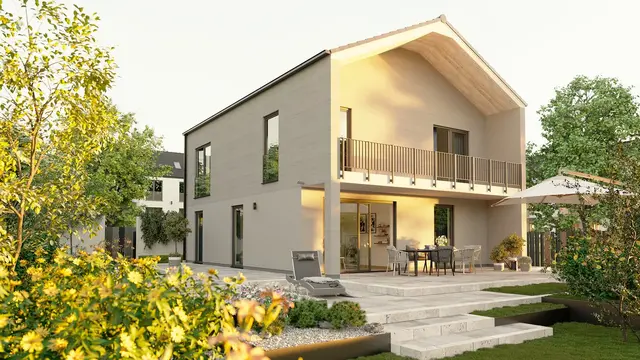 Modernes Massivhaus mit separatem Eingang und Garten Visualisierung eines zukunftssicher geplanten Massivhauses mit separatem Zugang und barrierefreiem Erdgeschoss.